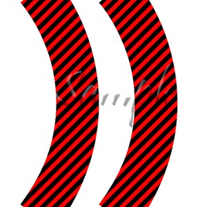 May include: Two red and black striped cupcake wrappers. The wrappers are curved and have a pointed end.