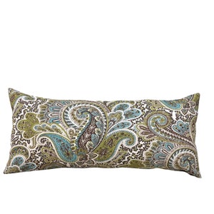 May include: A rectangular body pillow with a paisley pattern. The pillow features a white background with a repeating design of swirling paisley shapes in shades of green, blue, and brown. The pillow is designed for comfort and support.