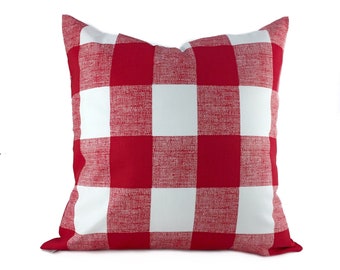 May include: Red and white checked throw pillow with a soft, textured fabric.