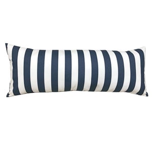 May include: A long, rectangular pillow with a navy blue and white striped pattern. The pillow is made of a soft, comfortable fabric and is perfect for adding a touch of style to any room.