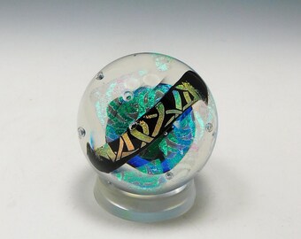 Colorful 2 1/2" diameter dichroic glass paperweight by Elaine Hyde