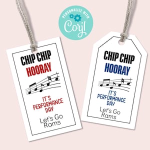 May include: Two white gift tags with black borders and string. One tag has red text that reads "CHIP CHIP HOORAY", musical notes, and "IT'S PERFORMANCE DAY". The other tag has blue text.