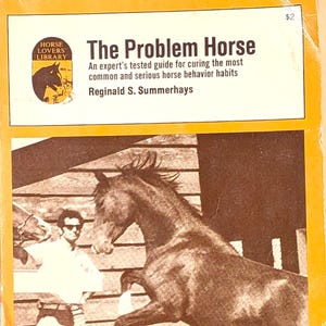 May include: Book cover showing a rearing brown horse. The title reads "The Problem Horse", with the text "An expert's tested guide for curing the most common and serious horse behavior habits" and the author's name, Reginald S. Summerhays.