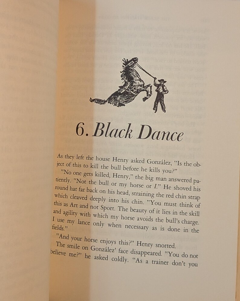 a page from a book titled 6. BLACK DANCE. there is a black and white drawing of a horse rearing up with a person holding a rope