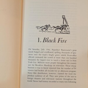 a page from a book titled 1. Black Fire. There is a black and white drawing of horses on a race track