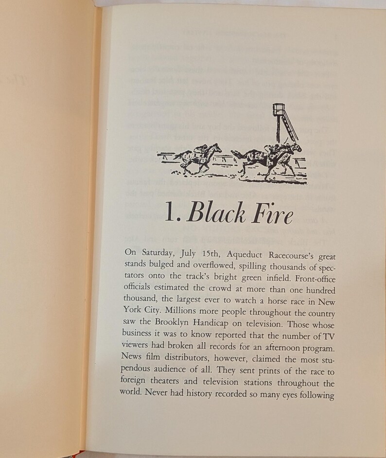 a page from a book titled 1. Black Fire. There is a black and white drawing of horses on a race track