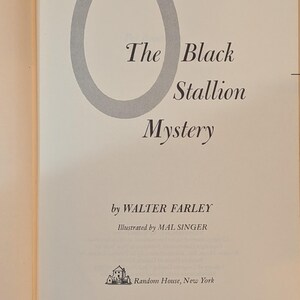 a title page from a book. The title is THE BLACK STALLION MYSTERY