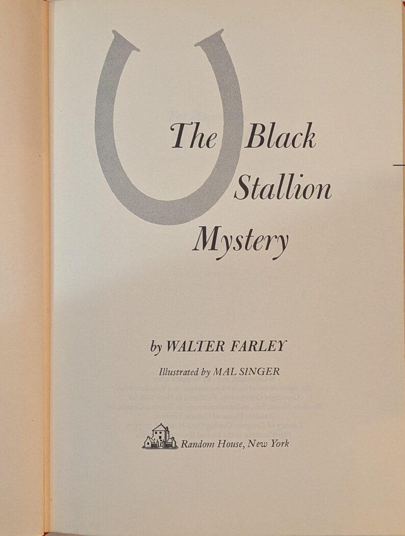 a title page from a book. The title is THE BLACK STALLION MYSTERY
