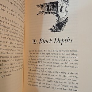 An open book page with text and a black and white illustration. The illustration depicts a building with a figure in front. The text reads "19. Black Depths". The page has a cream color.