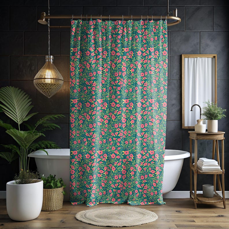 May include: A teal shower curtain with a repeating floral pattern of pink flowers and green leaves. The curtain hangs in front of a white bathtub, adding a pop of color to the bathroom decor.
