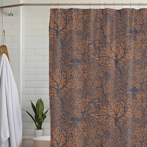 May include: A shower curtain with a brown and blue floral pattern. The pattern features stylized trees and leaves.