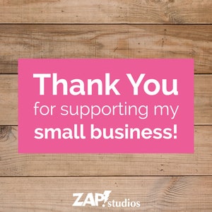 May include: Pink and white text on a wood background that reads "Thank You for supporting my small business!" with the text "ZAP! studios" below.