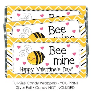 May include: Three printable candy bar wrappers with a yellow chevron pattern and a cute cartoon bee. The wrappers say "Bee mine" and "Happy Valentine's Day!" in black text.