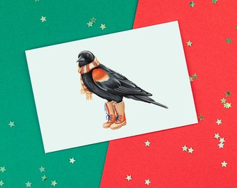 Carte d'oiseau de noël, carte de souhaits de Carouge à épaulettes en bottes d'hiver avec un foulard, carte de noël