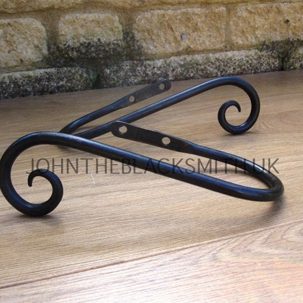 A Pair of Hand Forged Wrought Iron Scrolled Curtain Holdbacks: Blacksmith Made, Satin black finish