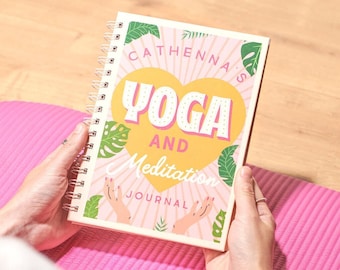 May include: A pink and yellow journal with the text "Cathenna's Yoga and Meditation Journal" and a heart-shaped illustration with the word "Yoga" inside.