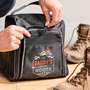 May include: Black shoe bag with a zip closure and a mesh pocket. The bag features a graphic design with the text "For Daddy's Adventure Boots".