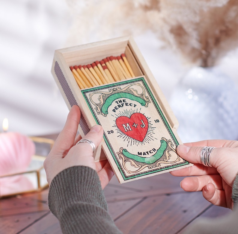 Personalised vintage-inspired matchbox with initials and year, perfect wedding gift. Unique keepsake for couples celebrating their special day.
