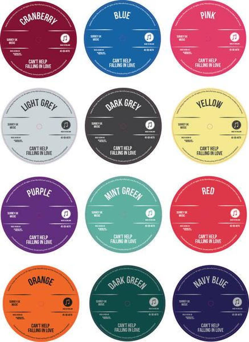 Twelve personalised vinyl record label colour options arranged in a grid, including cranberry, blue, pink, light grey, dark grey, yellow, purple, mint green, red, orange, dark green and navy blue.