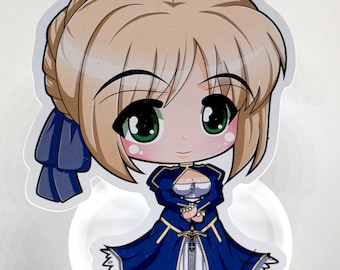 May include: A blue and white anime figurine of a girl with blonde hair, green eyes, and a sword. She is wearing a blue dress with gold trim and a blue ribbon in her hair.