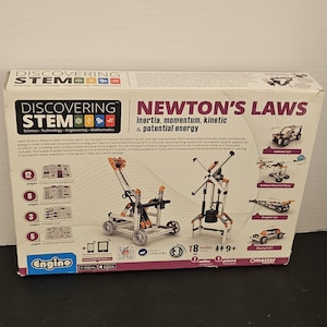May include: A rectangular cardboard box for a Discovering STEM Newton's Laws educational construction set. The white box features black and orange text, diagrams of building models, and icons indicating 8 models to build for ages 9 plus.