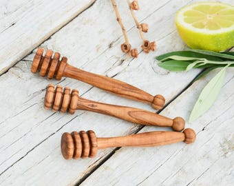 Cucchiaio dosatore per miele in legno d'ulivo: cucchiaio a filo con venature naturali (10 cm)