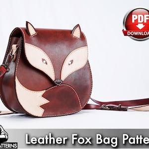 May include: A brown leather bag shaped like a fox with cream-colored accents on the face and tail. The bag features two pointed ears, a flap closure, and an adjustable shoulder strap. Text on the image reads PDF DOWNLOAD and LEATHER FOX BAG PATTERN.