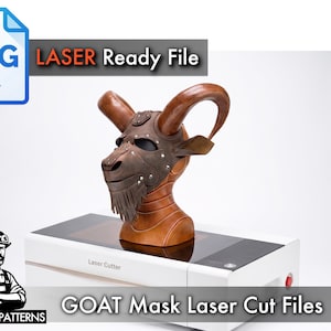 May include: A brown leather goat mask with large curved horns and a fringed beard, displayed on a tan mannequin head atop a white laser cutter. The image includes an SVG icon, the text LASER Ready File, and GOAT MASK Laser Cut Files.