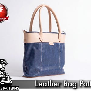 May include: A blue and tan leather tote bag with a rectangular shape and two handles. The bag has a light tan top section and handles, with a darker blue body. The text "Leather Bag Pattern" is visible.