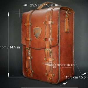 May include: A brown leather backpack with a buckle closure and a stitched design. The backpack measures 14.5 inches tall, 10 inches wide, and 5.3 inches deep. The bag has a logo on the front that says "DIESELPUNK.RO" and "www.dieselpunk.ro".