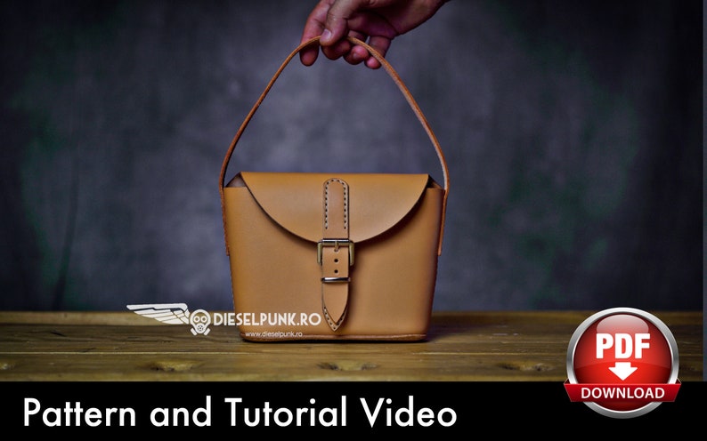 May include: A brown leather handbag with a buckle closure and a top handle. The bag is sitting on a wooden surface. Pattern and Tutorial Video. PDF Download.