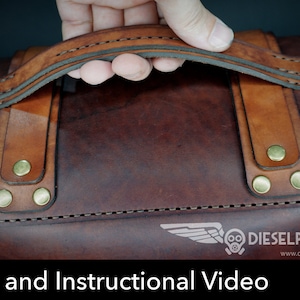 May include: A brown leather bag with a top handle and brass rivets. The bag has a stitched design around the edges. The bag is labeled "DIESELPUNK.RO" and "www.dieselpunk.ro".