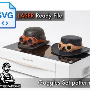 May include: Two hats with goggles, a laser-ready SVG file, and the text "Goggles Set pattern." One hat is black with tan goggles, and the other is a distressed brown with tan goggles. The image also includes a laser cutter and a logo.