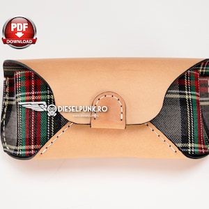 May include: A brown leather glasses case with a plaid fabric lining. The case has a stitched seam and the text "DIESELPUNK.RO" is printed on the front.
