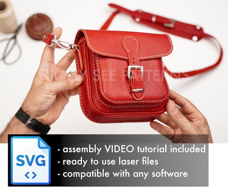 May include: A red leather crossbody bag with white stitching and a silver buckle closure. The bag has a flap top and a shoulder strap. The image includes text that says "assembly VIDEO tutorial included", "ready to use laser files", and "compatible with any software".