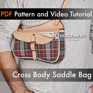 May include: A gray and red plaid cross body saddle bag with a brown leather flap and buckle. The bag is worn by a person and has the text "DIESELPUNK.RO" on the flap.