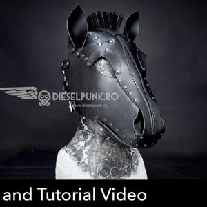 May include: A black leather horse mask featuring a structured design with pointed ears, a central mane, and silver-toned metal rivets along the seams. The mask includes the text DIESELPUNK.RO and the words Pattern and Tutorial Video.