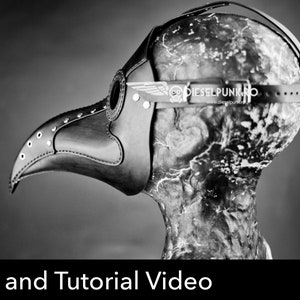 May include: Black and white image of a plague doctor mask. The mask is made of leather and features a long, beak-like nose, eye holes, and a strap to secure it to the head. The text "DIESELPUNK.RO" is visible on the mask.