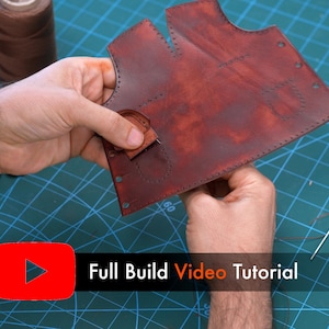 May include: A dark red leather piece with pre-punched stitching holes and a small attached leather tab. The text "Full Build Video Tutorial" is displayed in white and orange next to a red YouTube play icon on the screen.