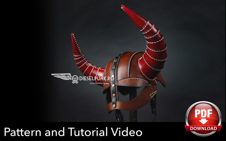 May include: A red leather helmet with horns, featuring a stitched design and a black leather visor. The helmet is on a stand and has a white background.