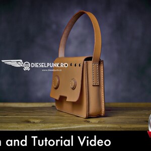 May include: A brown leather handbag with a top handle and a flap closure. The bag has two metal buttons on the front and is stitched with white thread. The bag is sitting on a wooden surface.  Pattern and Tutorial Video PDF Download.