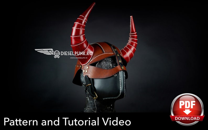 May include: A leather helmet with red horns and a black face mask. The helmet has a brown leather strap and white stitching. The helmet is on a black background. Pattern and Tutorial Video. PDF Download.