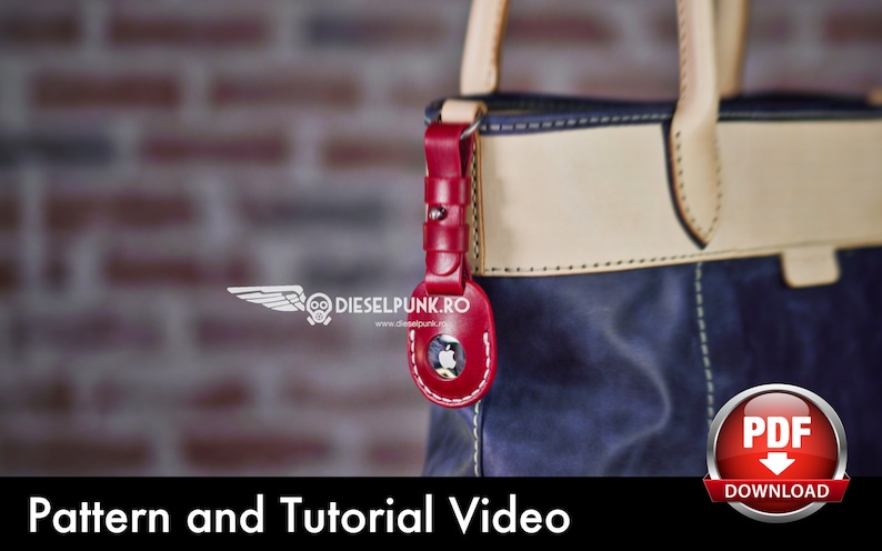 May include: A close-up of a blue leather tote bag with a red leather keychain featuring an apple logo. The bag has a cream-colored leather trim and stitching. The image includes the text "Pattern and Tutorial Video" and a download button labeled "PDF".