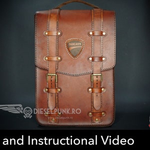 May include: A brown leather motorcycle bag with a Ducati logo and buckles. The bag has a stitched design and the text "dieselpunk.ro" is printed on the front.