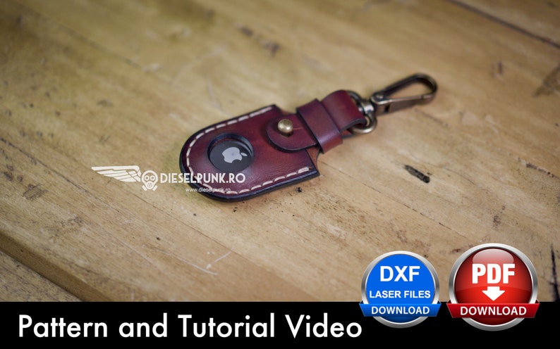 May include: A brown leather keychain with a stitched edge and a metal clasp. The keychain has a cutout for an Apple logo. The image includes the text "Pattern and Tutorial Video" and buttons for downloading DXF and PDF files.