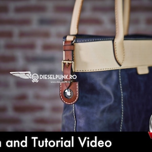 May include: A close-up of a blue leather tote bag with a tan leather top flap and brown leather straps. The bag has a metal buckle and a small leather tag with a logo. The bag is in front of a brick wall. The text "Pattern and Tutorial Video" is at the bottom of the image. A red button with the text "PDF DOWNLOAD" is in the lower right corner.