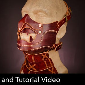 May include: A dark reddish-brown leather face mask with a stylized tooth design, featuring visible light-colored stitching, metallic rivets, and adjustable buckled straps. The text "PDF DOWNLOAD" and "Pattern and Tutorial Video" are visible.