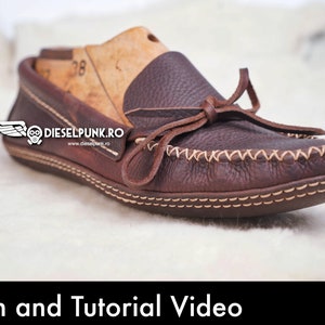May include: Brown leather moccasin with a tied bow and white stitching detail. The moccasin is on a white fluffy surface. The text "Pattern and Tutorial Video" is at the bottom of the image. A red button with a white arrow pointing down and the text "PDF DOWNLOAD" is in the bottom right corner of the image.