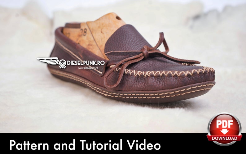 May include: Brown leather moccasin with a tied bow and white stitching detail. The moccasin is on a white fluffy surface. The text "Pattern and Tutorial Video" is at the bottom of the image. A red button with a white arrow pointing down and the text "PDF DOWNLOAD" is in the bottom right corner of the image.