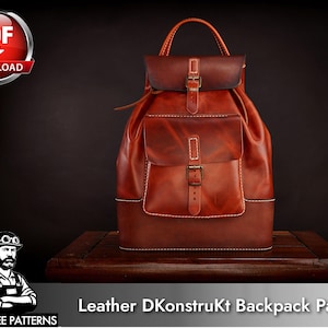 May include: A reddish-brown leather backpack featuring a top flap with a buckle closure, a front pocket with a matching buckle, a top handle, and visible white stitching. The text "Leather DKonstruKt Backpack Patterns" and "TONY SEE PATTERNS" is visible.